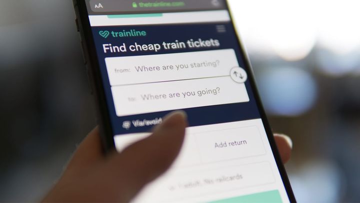 User looking at the Trainline app